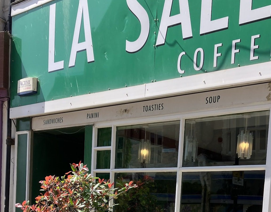 The green LA SALLE VERTE coffee shop sign above the windows